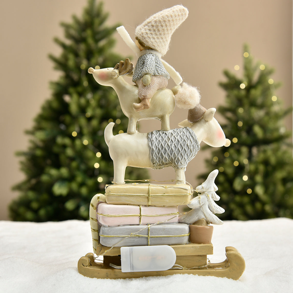 Figurine de Noël Enfant sur renne Pastel