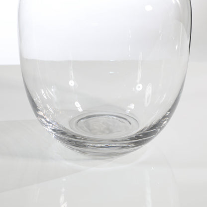 Vase transparent, rond, avec un large col.