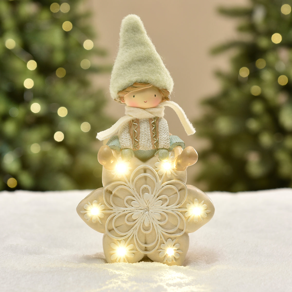 Figurine de Noël garçon avec bonnet vert sur flocon LED