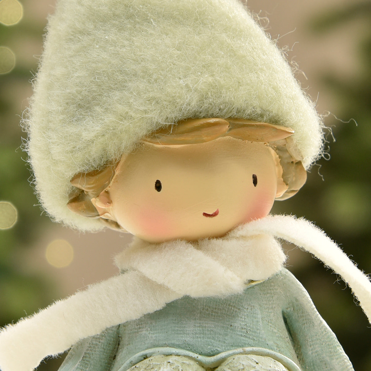 Figurine de Noël garçon avec bonnet vert sur flocon LED