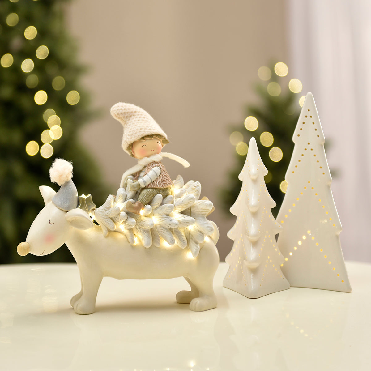 Figurine de Noël Enfant sur renne Pastel LED