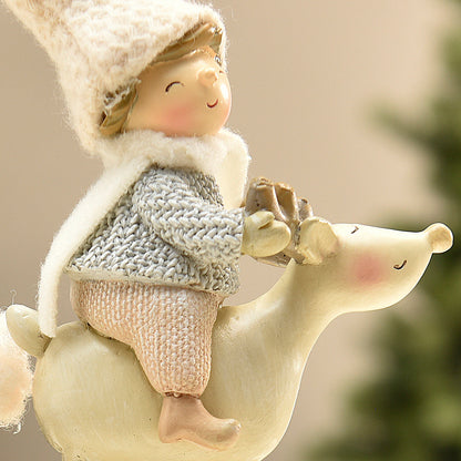 Figurine de Noël Enfant sur renne Pastel